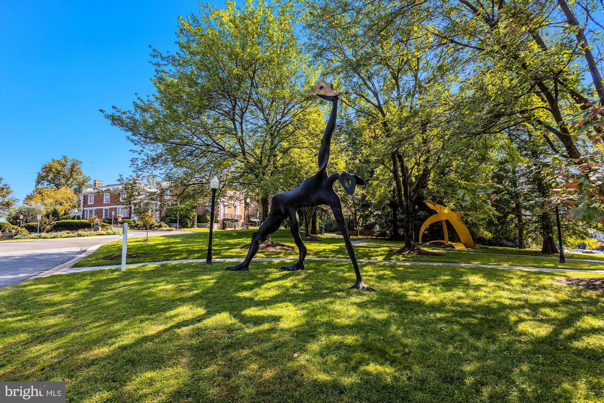 5343 Pooks Hill Road, Unit 40353 Bethesda, MD 20814 - Photo 31 of 57 a view of swimming pool with a backyard and slide