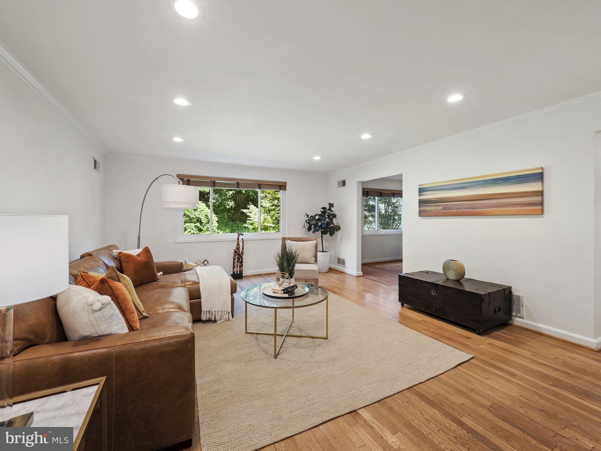5343 Pooks Hill Road, Unit 40353 Bethesda, MD 20814 - Photo 5 of 57 a living room with furniture and a window