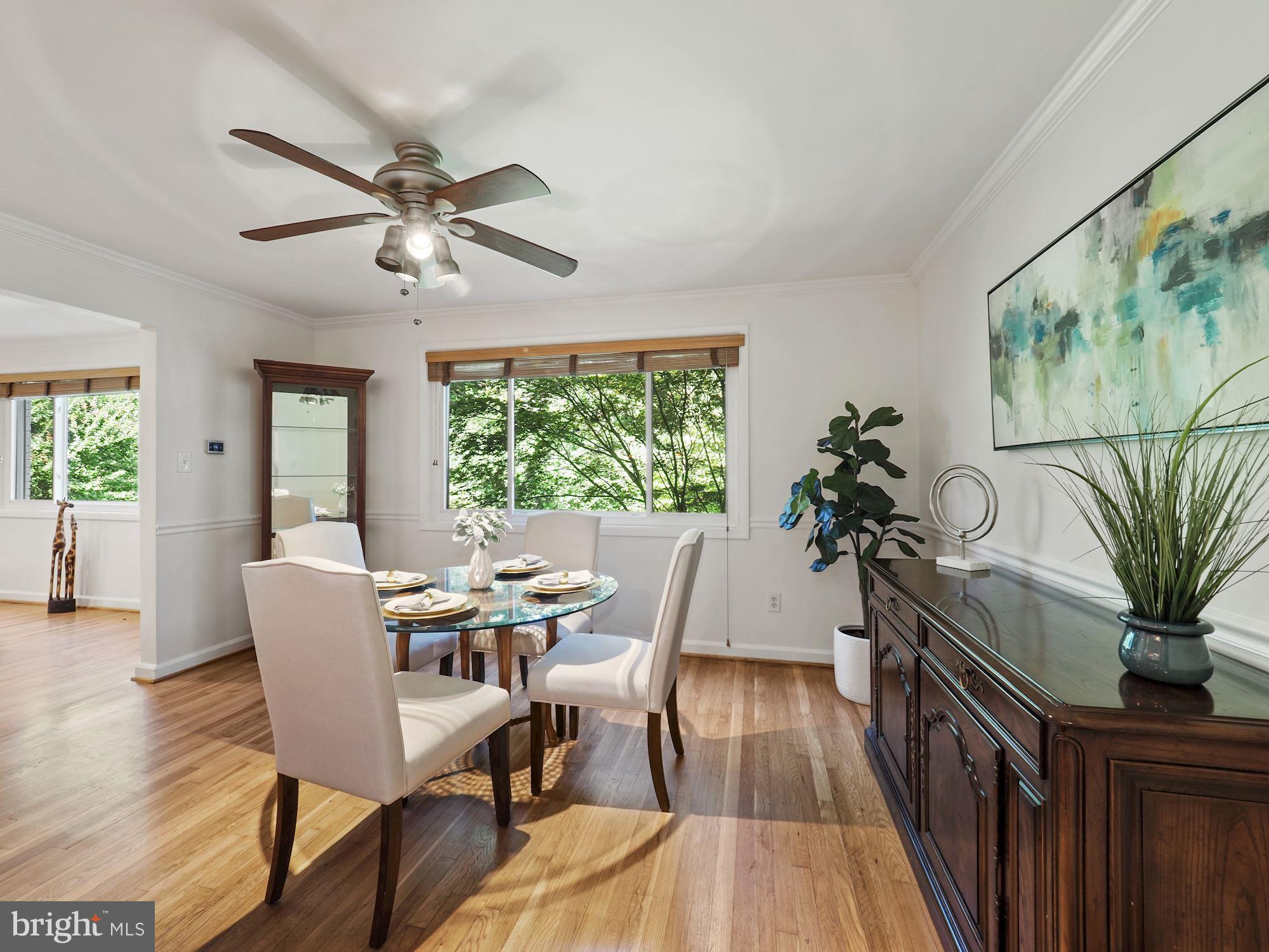 5343 Pooks Hill Road, Unit 40353 Bethesda, MD 20814 - Photo 7 of 57 a view of a dining room with furniture window and wooden floor