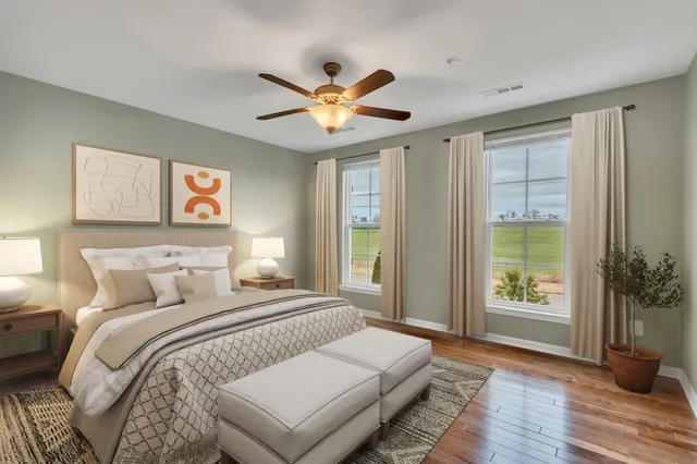 a bedroom with a large bed and a window