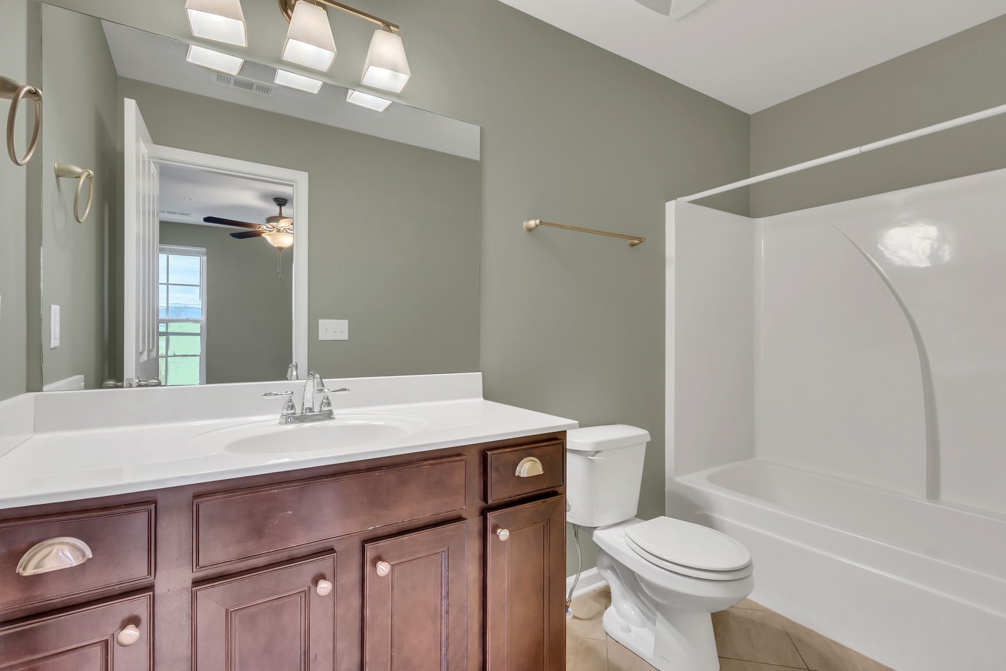 305 Dursley Lane Spring Hill, TN 37174 - Photo 20 of 25 a bathroom with a sink a toilet and shower