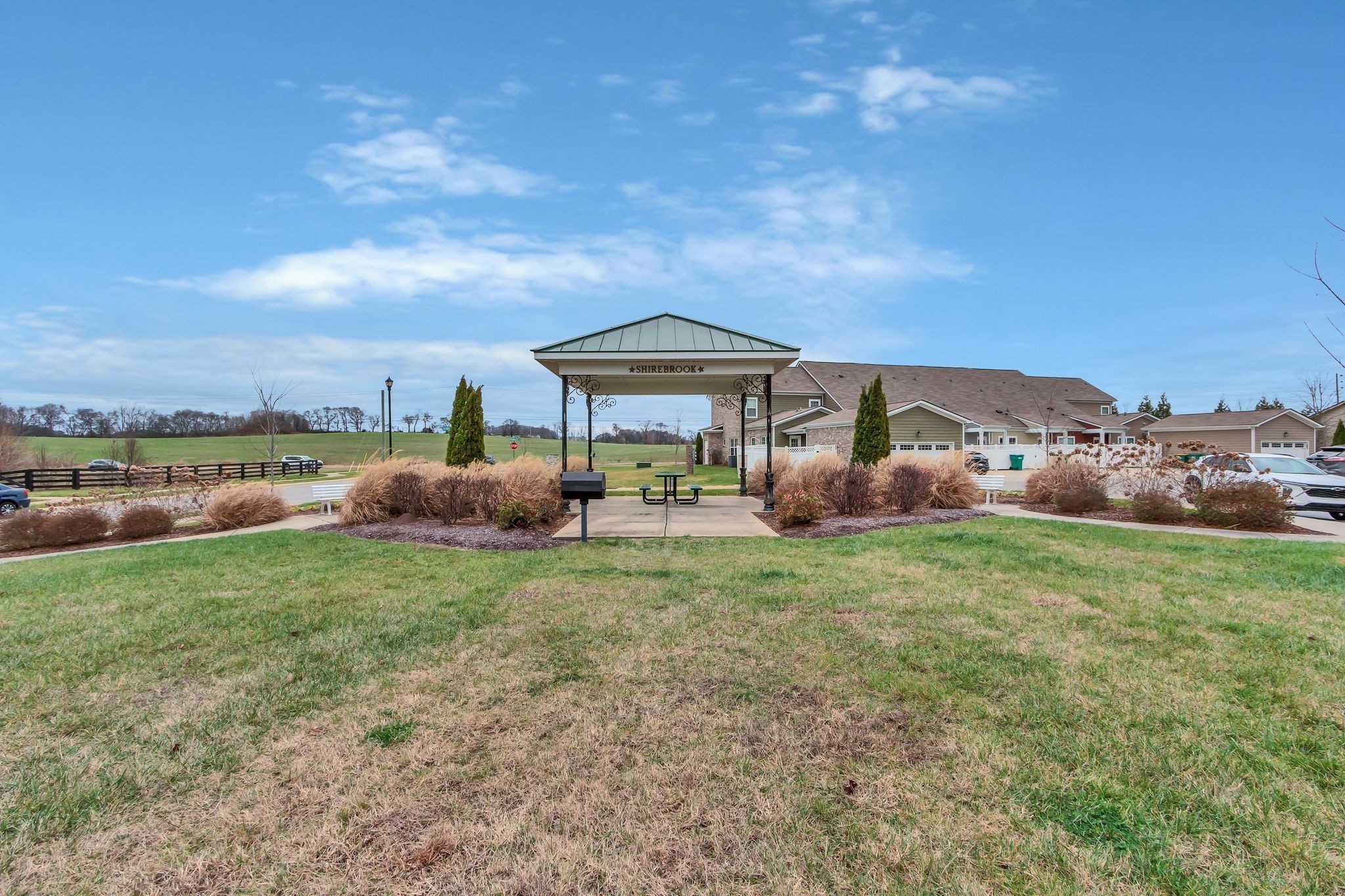 305 Dursley Lane Spring Hill, TN 37174 - Photo 25 of 25 a backyard of a house with table and chairs