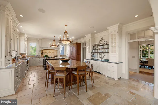 a spacious bathroom with a sink a large mirror and a bathtub
