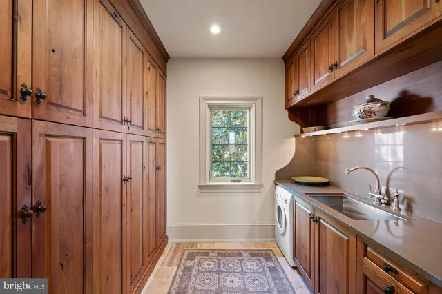 a view of a living room and chandelier fan