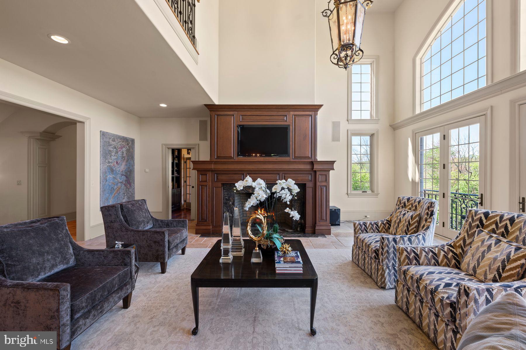 925 Drovers Lane Chester Springs, PA 19425 - Photo 31 of 96 a living room with furniture a flat screen tv and a fireplace