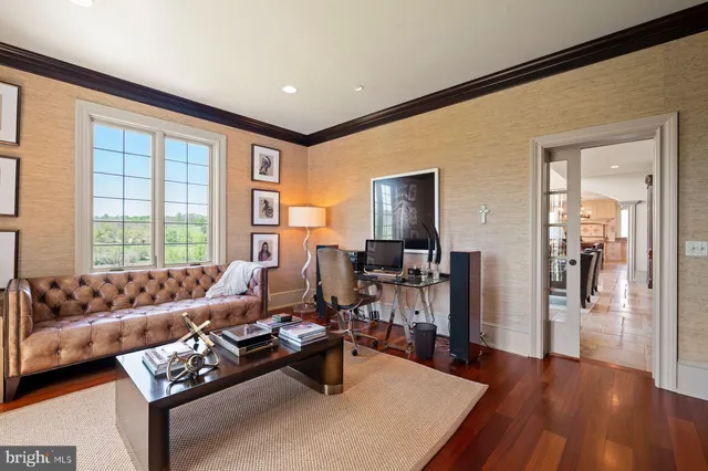 a bathroom with a granite countertop toilet a sink and a mirror
