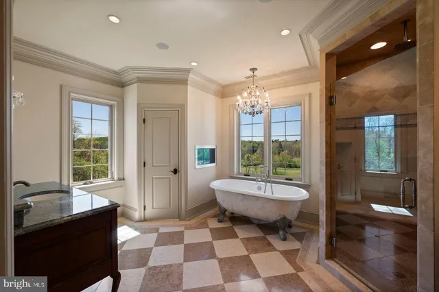 a bathroom with a double vanity sink a mirror and a shower