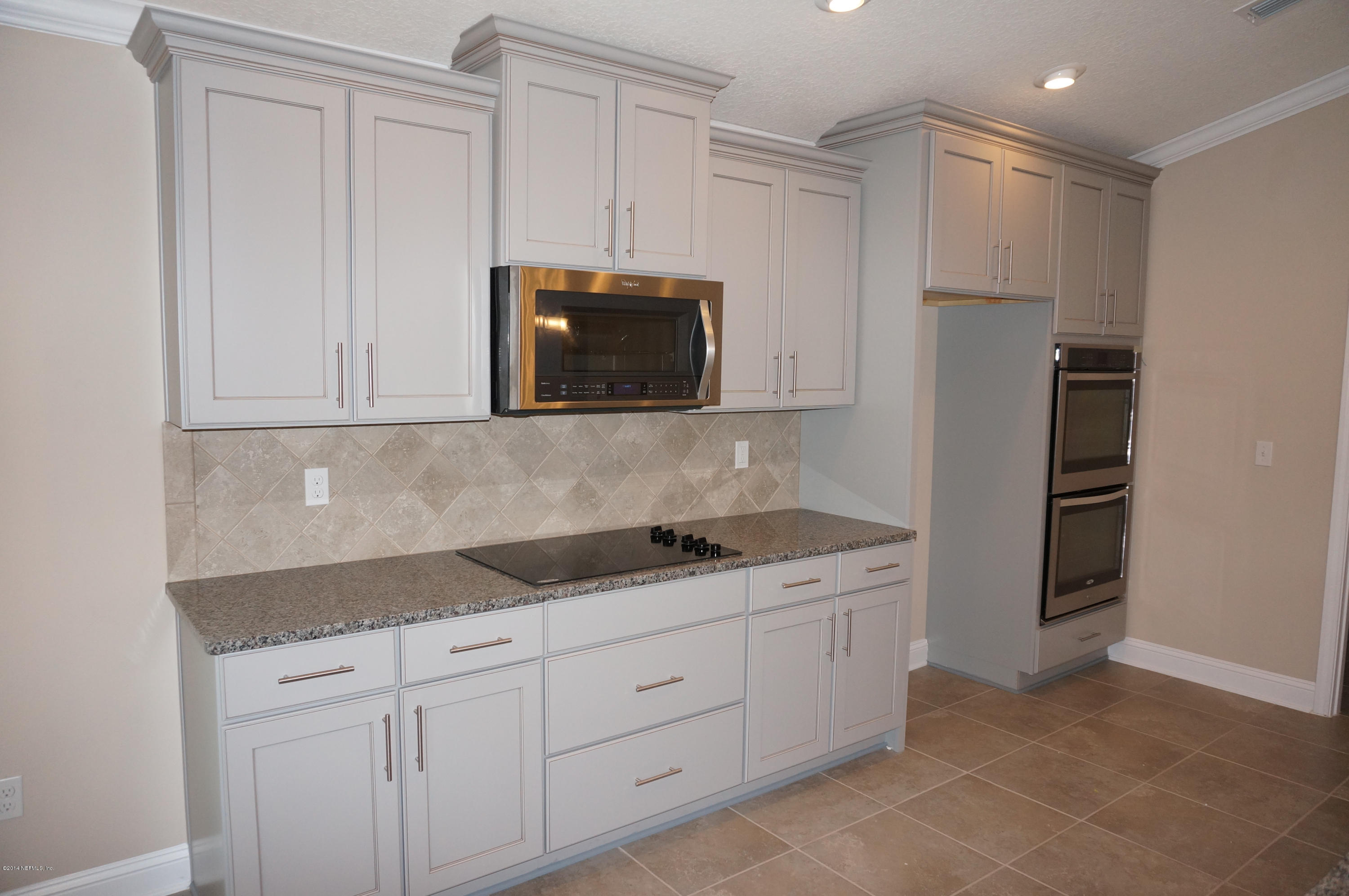 159 Prince Albert Avenue St. Johns, FL 32259 - Photo 23 of 43 a kitchen with stainless steel appliances granite countertop white cabinets and a sink