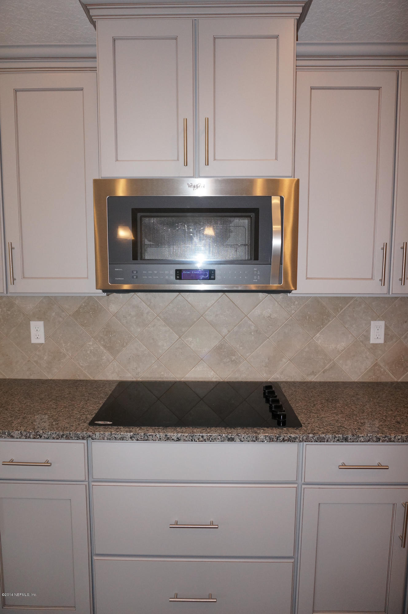 159 Prince Albert Avenue St. Johns, FL 32259 - Photo 24 of 43 a kitchen with granite countertop white cabinets white stainless steel appliances and granite counter tops