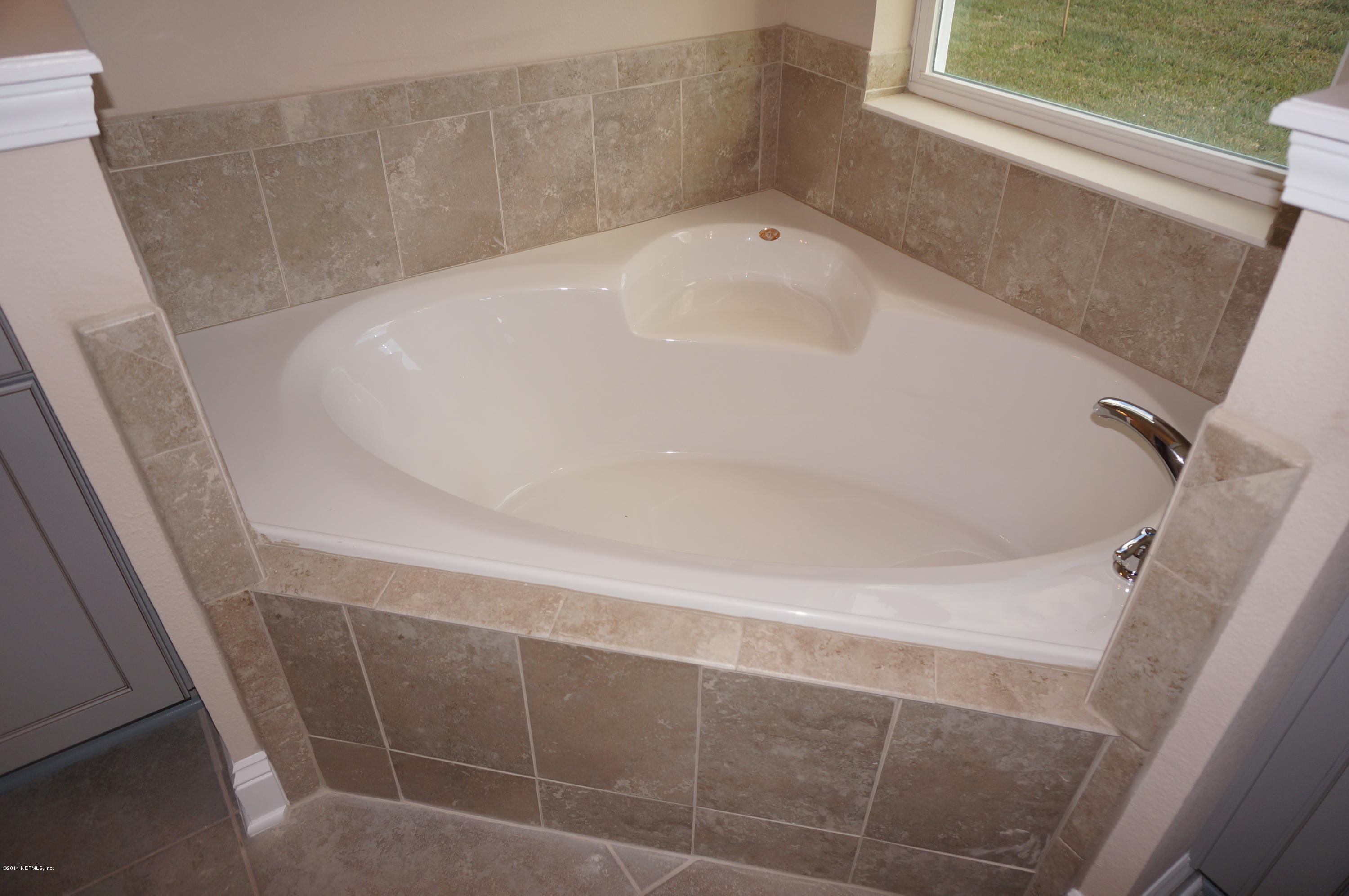 159 Prince Albert Avenue St. Johns, FL 32259 - Photo 34 of 43 a white bath tub sitting in a bathroom