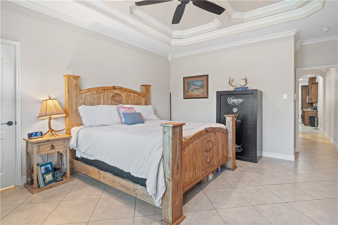 6934 Wooldridge Road, Unit K Corpus Christi, TX 78414 - Photo 13 of 20 a bed room with a bed and a fireplace