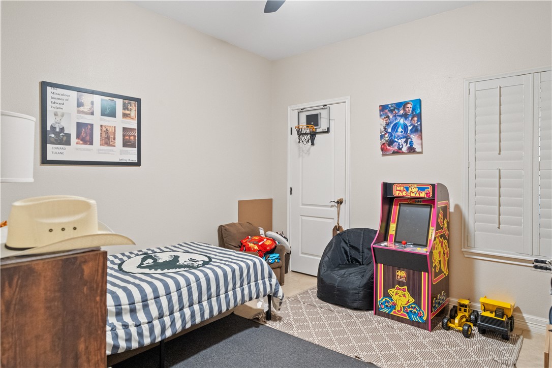 6934 Wooldridge Road, Unit K Corpus Christi, TX 78414 - Photo 17 of 20 a bedroom with a bed and wooden floor