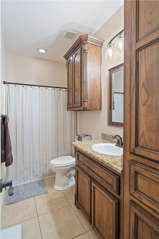 6934 Wooldridge Road, Unit K Corpus Christi, TX 78414 - Photo 18 of 20 a bathroom with a granite countertop sink and a mirror