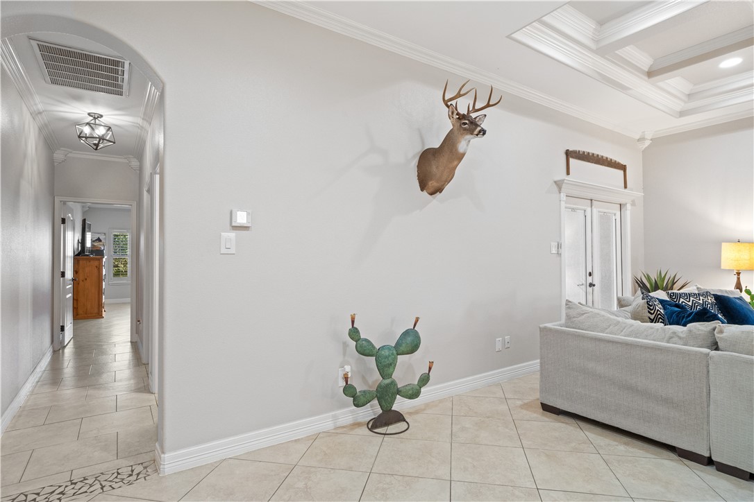 6934 Wooldridge Road, Unit K Corpus Christi, TX 78414 - Photo 7 of 20 a living room with furniture and a chandelier