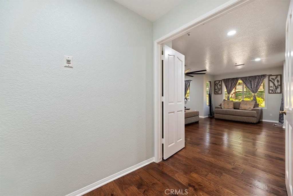 923 Devore Road San Bernardino, CA 92407 - Photo 23 of 65 a view of living room with furniture and wooden floor