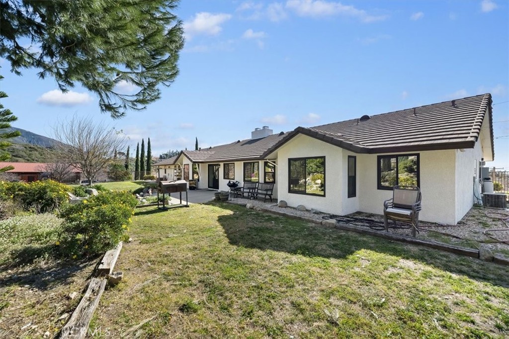 923 Devore Road San Bernardino, CA 92407 - Photo 36 of 65 a view of a house with swimming pool and sitting area