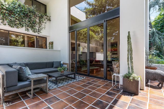 a couple of chairs in front of house