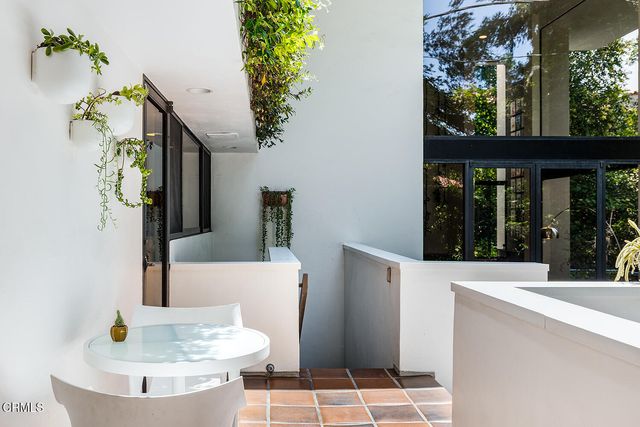 a bathroom with a tub and shower