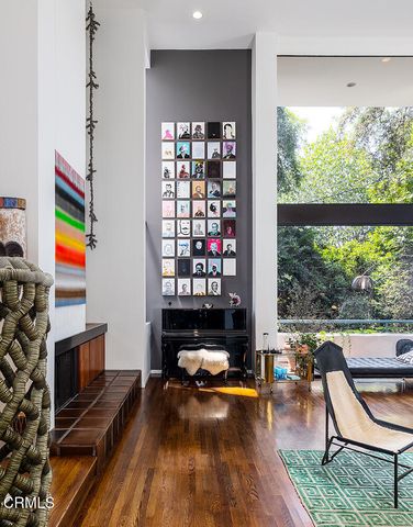 a room with furniture and a floor to ceiling window