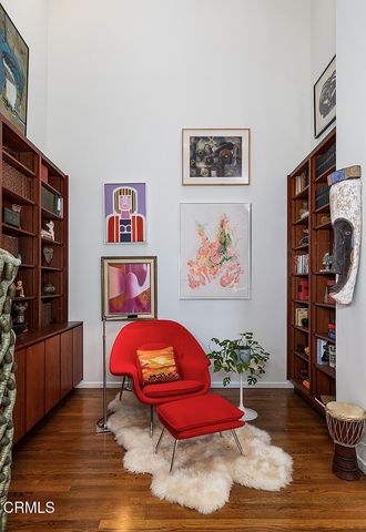 a bedroom with furniture and book shelf