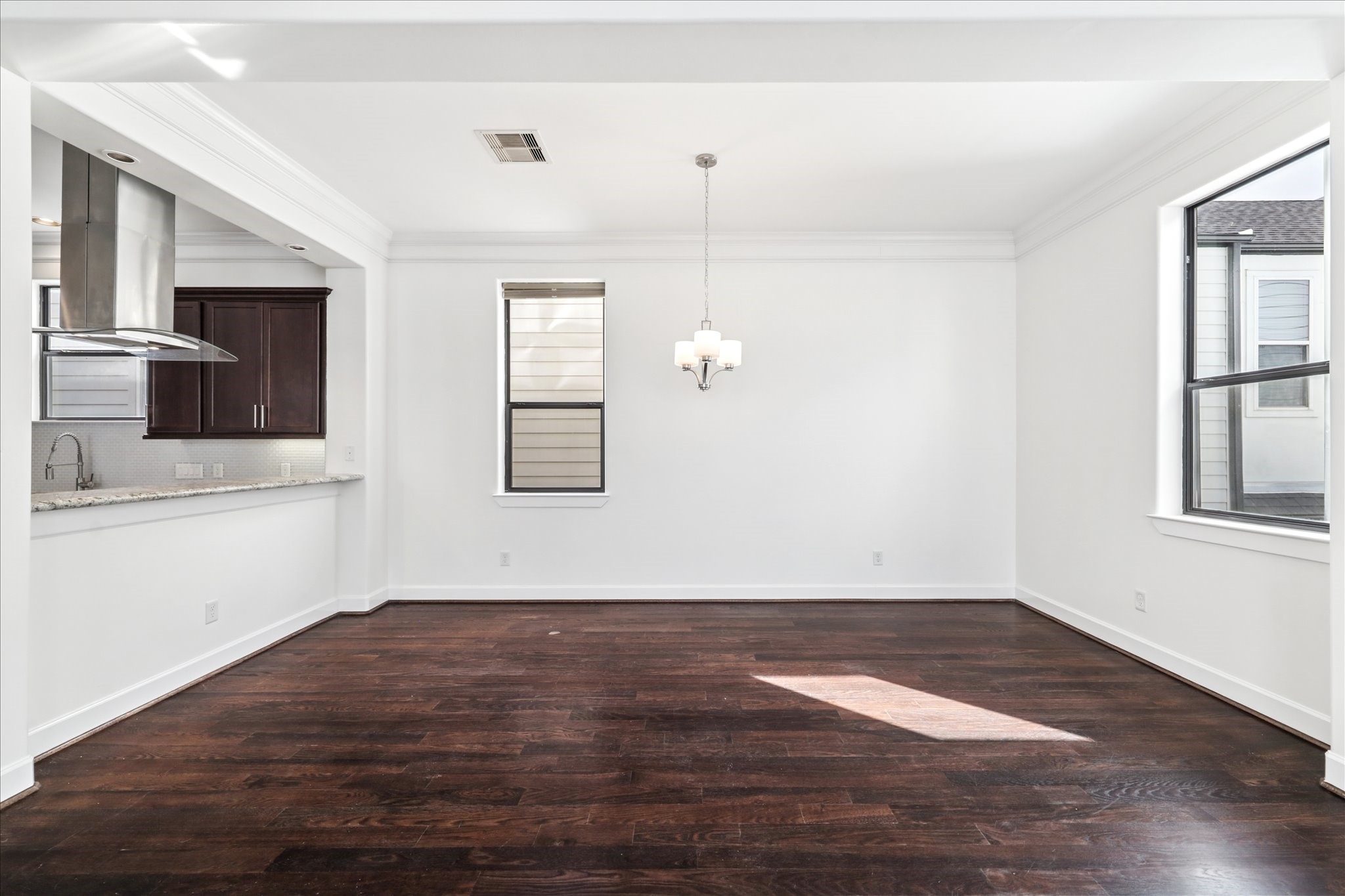 830 West 19th Street, Unit B Houston, TX 77008 - Photo 11 of 38 an empty room with wooden floor and windows