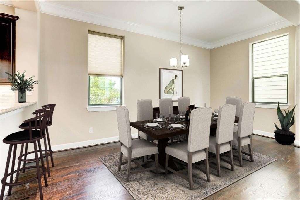 830 West 19th Street, Unit B Houston, TX 77008 - Photo 12 of 38 a view of a dining room with furniture window and wooden floor