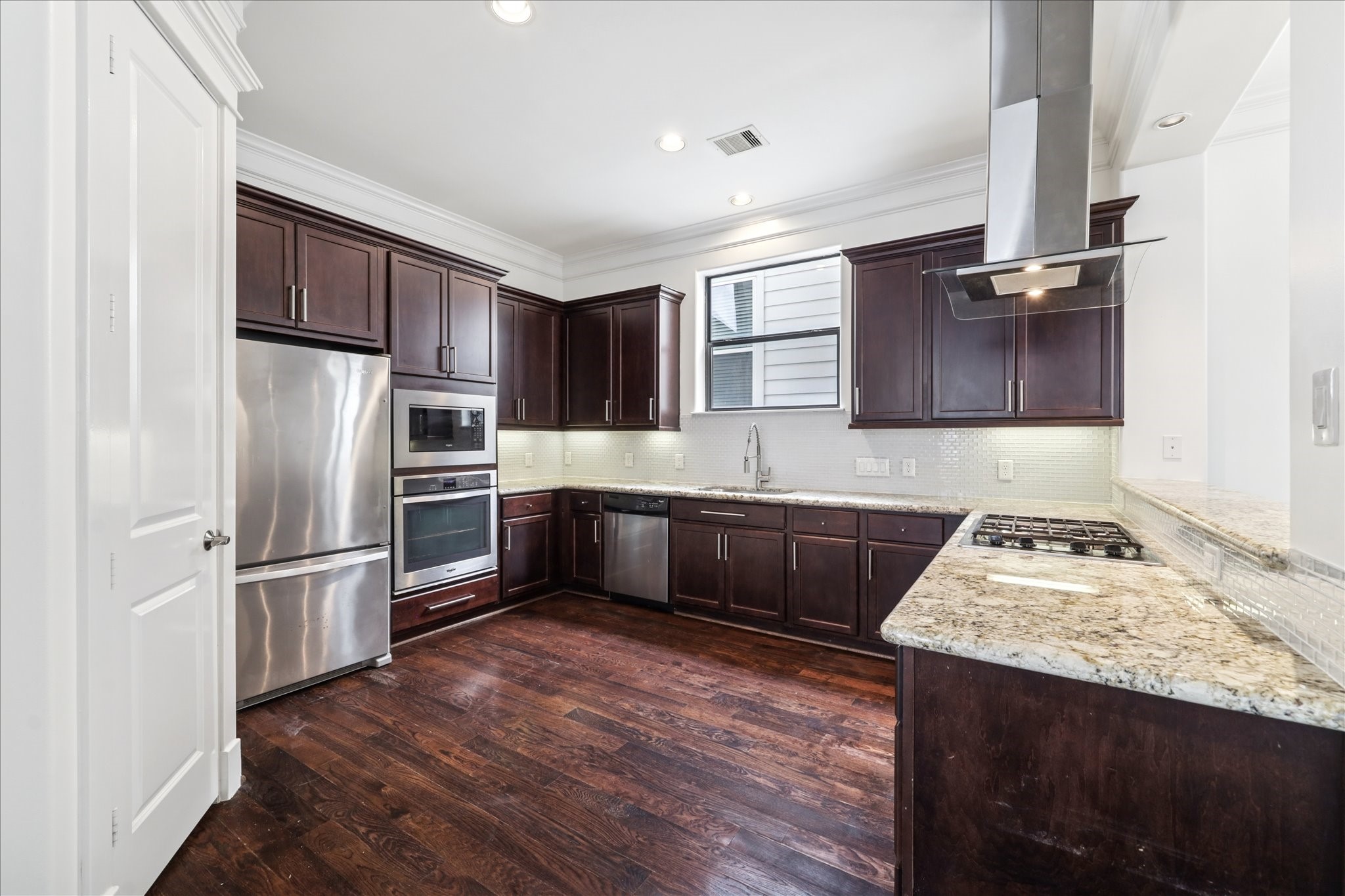 830 West 19th Street, Unit B Houston, TX 77008 - Photo 14 of 38 a kitchen with granite countertop a refrigerator and a sink