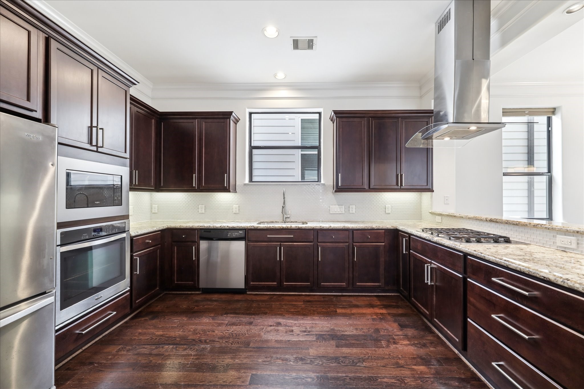 830 West 19th Street, Unit B Houston, TX 77008 - Photo 15 of 38 a kitchen with stainless steel appliances granite countertop a sink and stove top oven