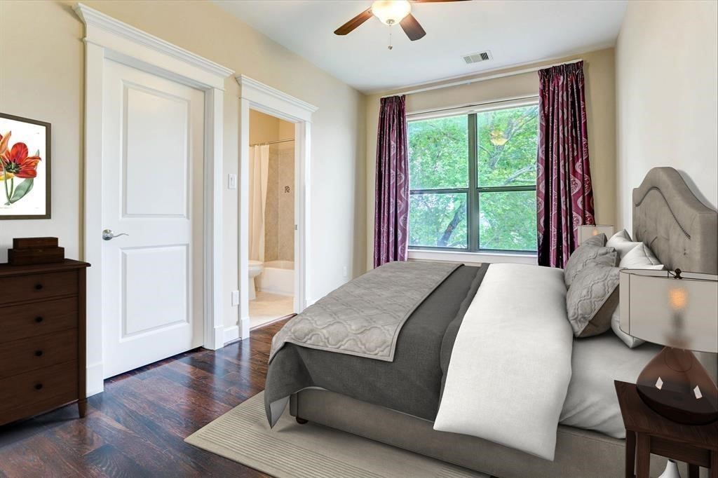 830 West 19th Street, Unit B Houston, TX 77008 - Photo 27 of 38 a bedroom with a bed and wooden floor