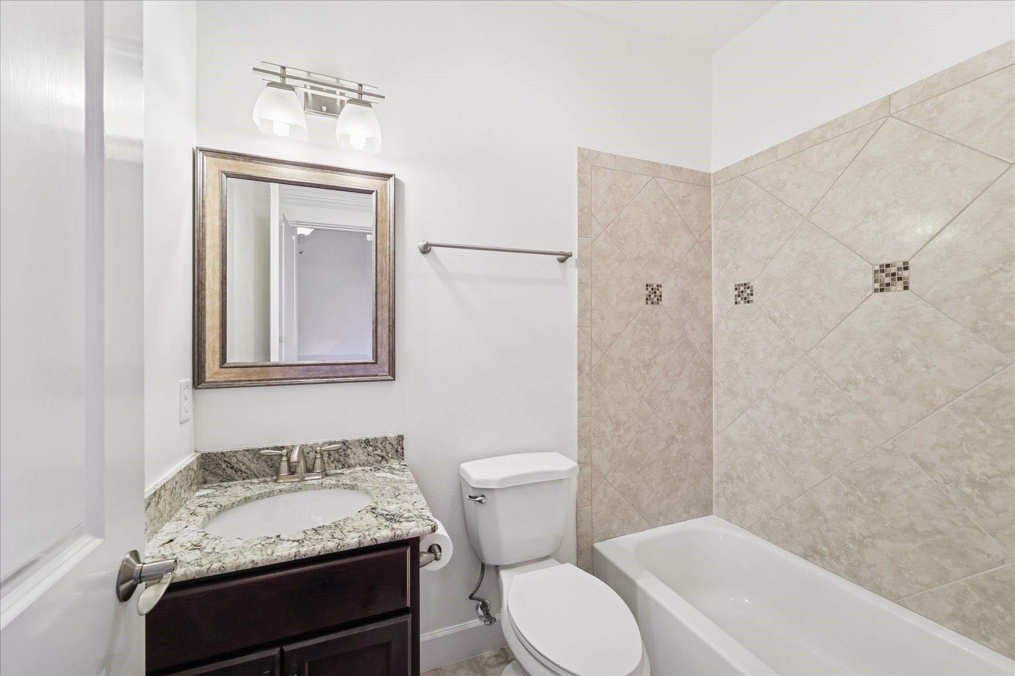830 West 19th Street, Unit B Houston, TX 77008 - Photo 28 of 38 a bathroom with a granite countertop sink toilet and shower