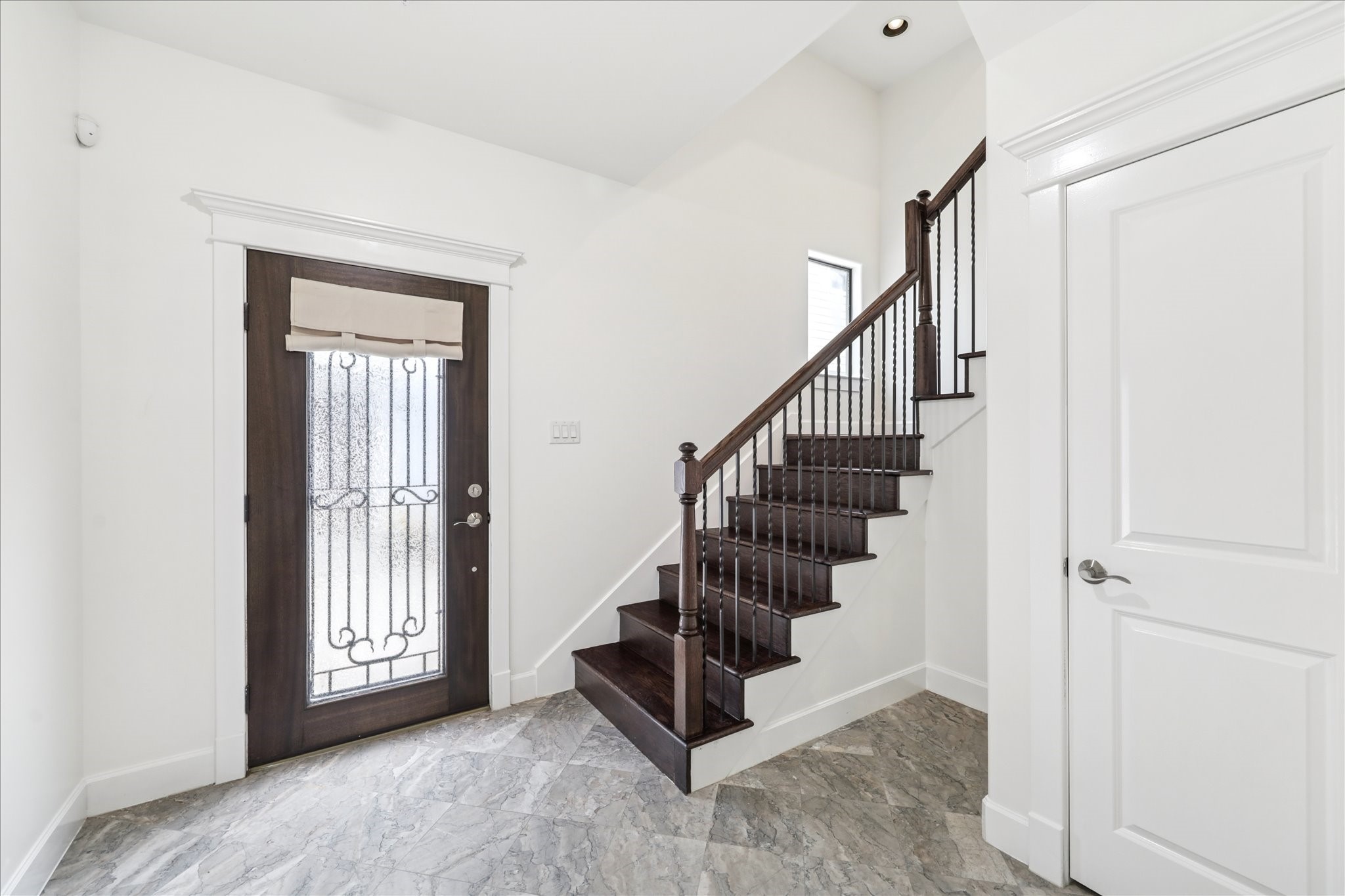 830 West 19th Street, Unit B Houston, TX 77008 - Photo 4 of 38 a view of entryway with wooden floor and stairs