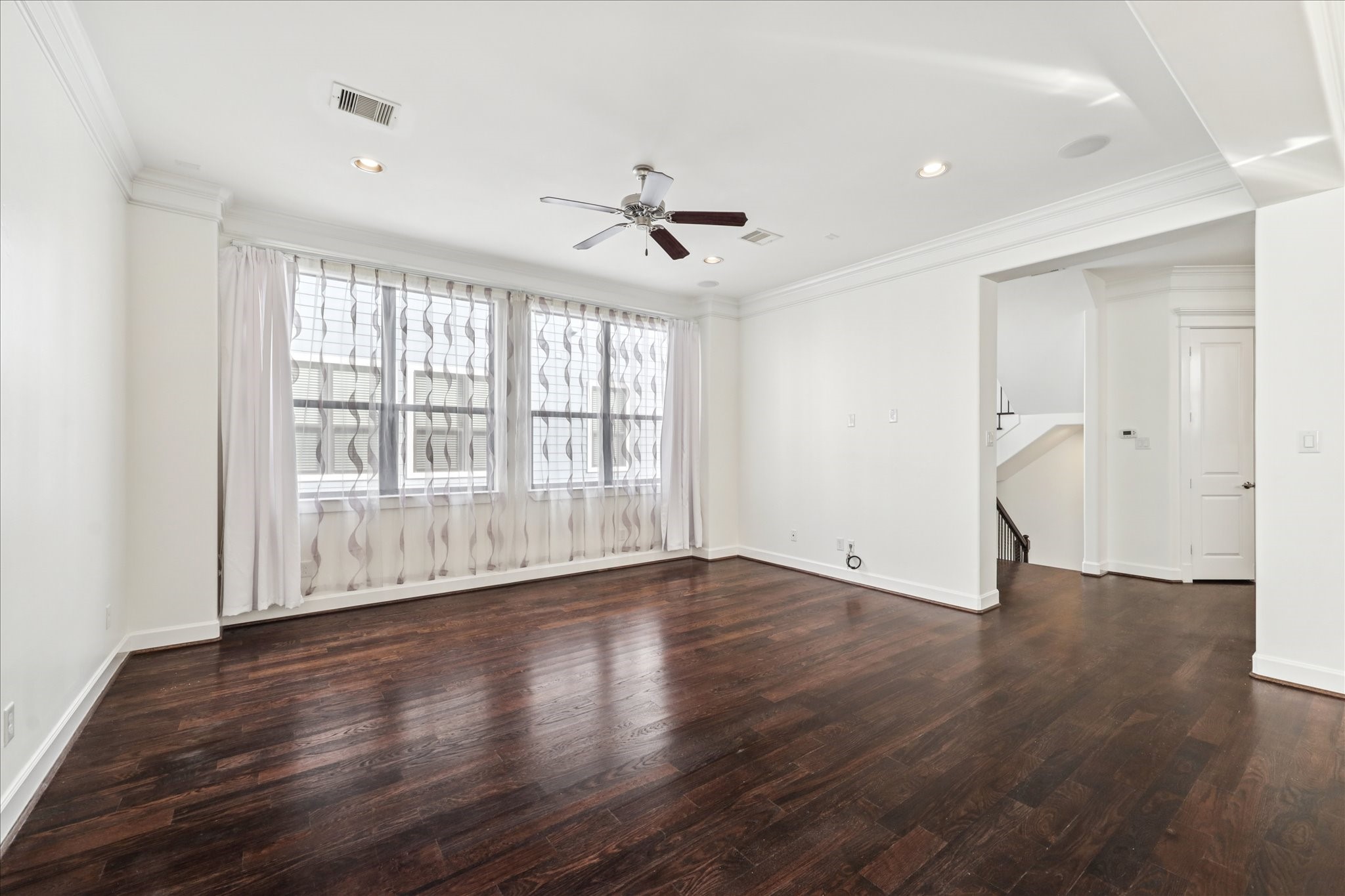 830 West 19th Street, Unit B Houston, TX 77008 - Photo 9 of 38 wooden floor in an empty room with a window