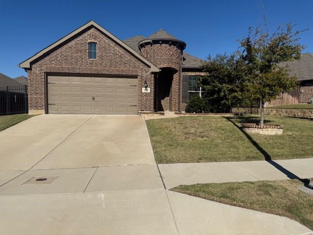 7208 Windy Ridge Drive Fort Worth, TX 76123 - Photo 2 of 13 a front view of a house with garden