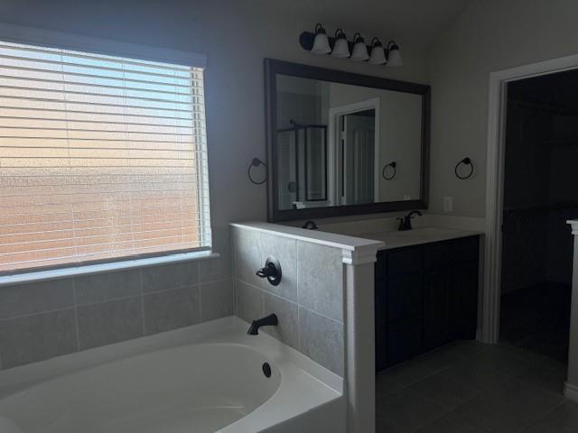 7208 Windy Ridge Drive Fort Worth, TX 76123 - Photo 8 of 13 a bathroom with a sink and a bathtub