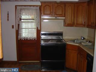 1425 Steel Road Havertown, PA 19083 - Photo 3 of 6 a kitchen with a sink and cabinets