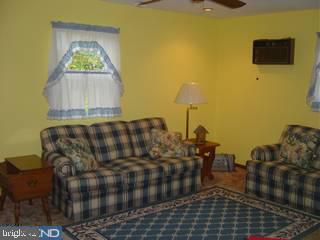 1425 Steel Road Havertown, PA 19083 - Photo 4 of 6 a living room with couches chair and a stove with wooden floor