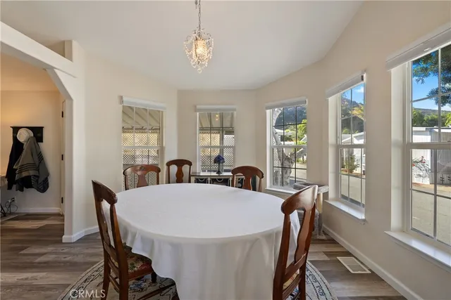 a view of a dining room with furniture window and wooden floor