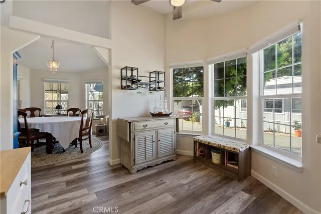 a room with dining table wooden floor and furniture