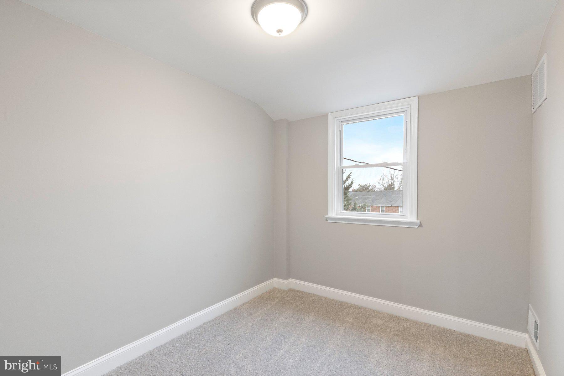 1659 Thetford Road Towson, MD 21286 - Photo 12 of 25 an empty room with windows
