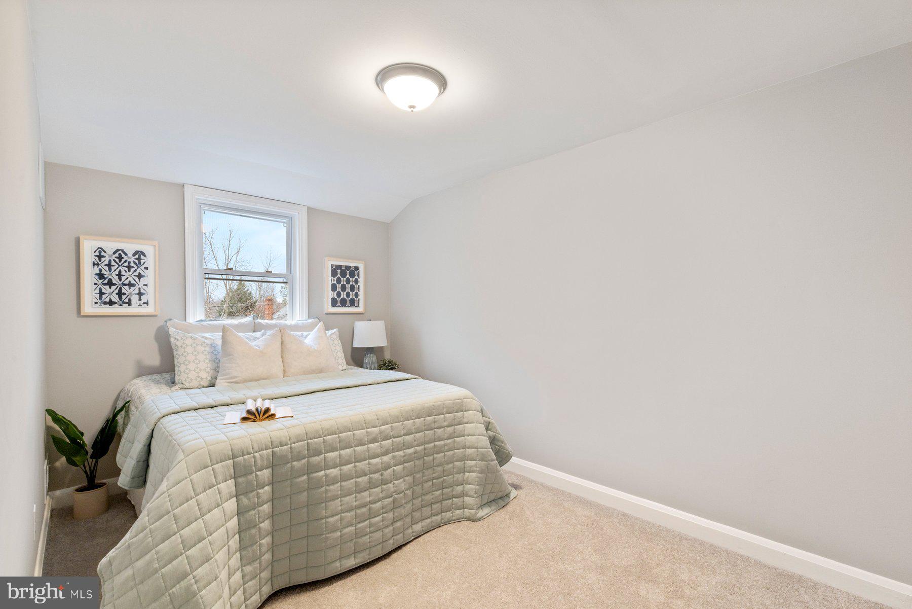 1659 Thetford Road Towson, MD 21286 - Photo 14 of 25 a bedroom with a bed and a night stand