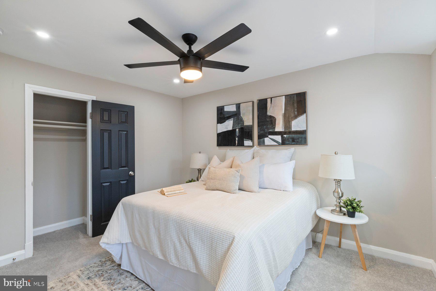 1659 Thetford Road Towson, MD 21286 - Photo 17 of 25 a bedroom with a large bed and a chandelier