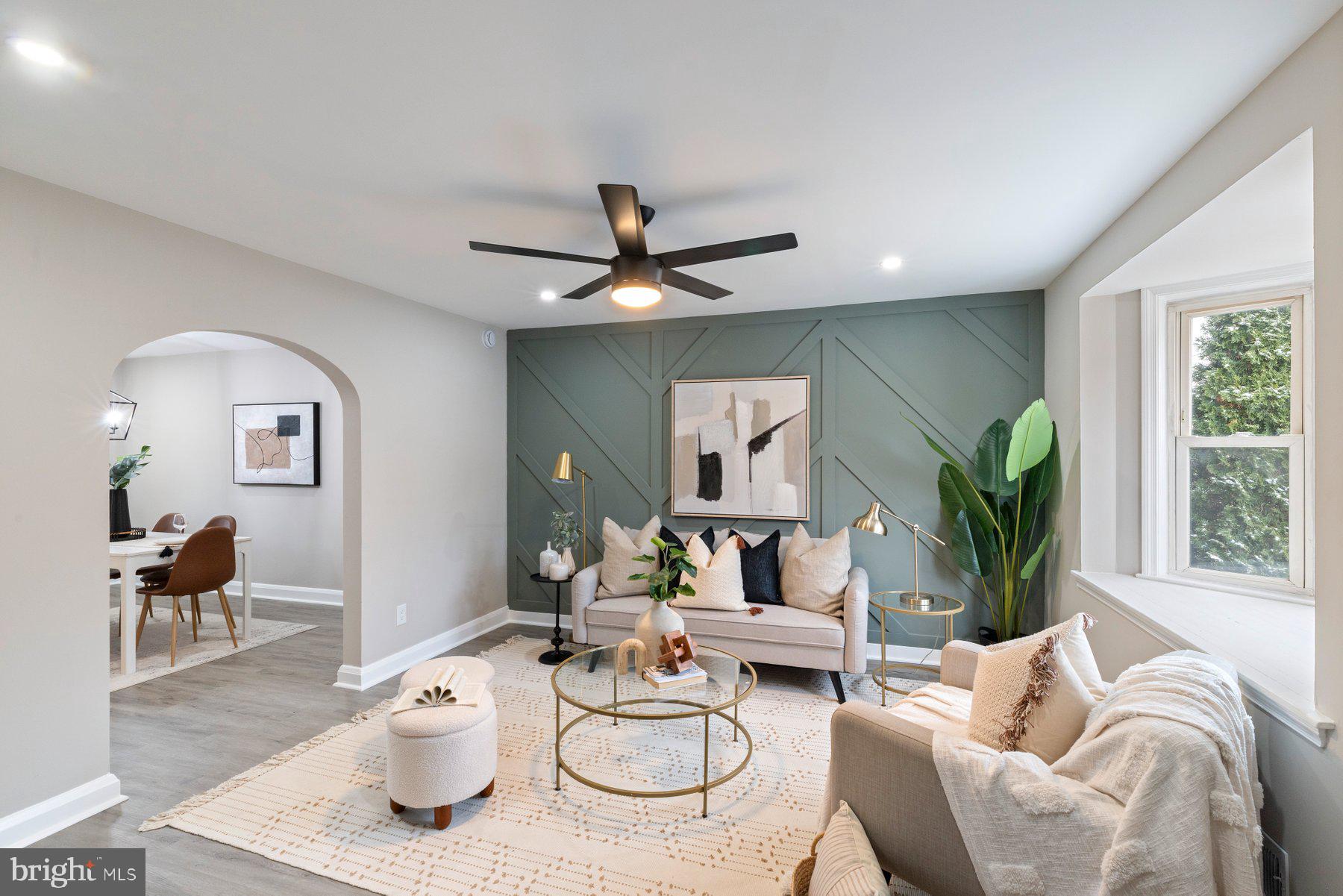 1659 Thetford Road Towson, MD 21286 - Photo 5 of 25 a living room with furniture a window and a potted plant