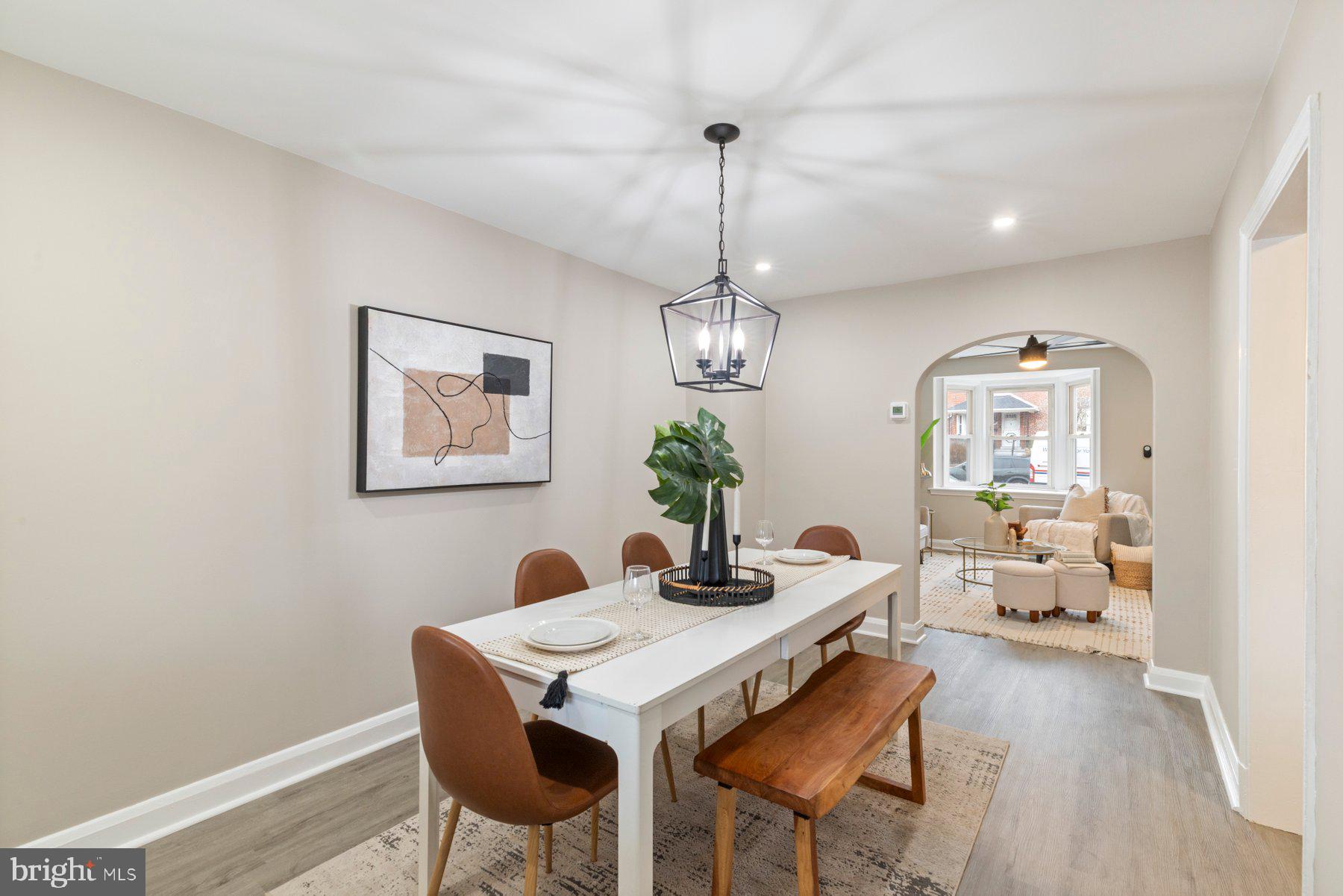 1659 Thetford Road Towson, MD 21286 - Photo 8 of 25 a view of a dining room with furniture wooden floor and a chandelier