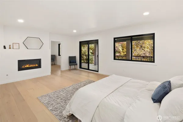 a bedroom with a large bed and a dresser