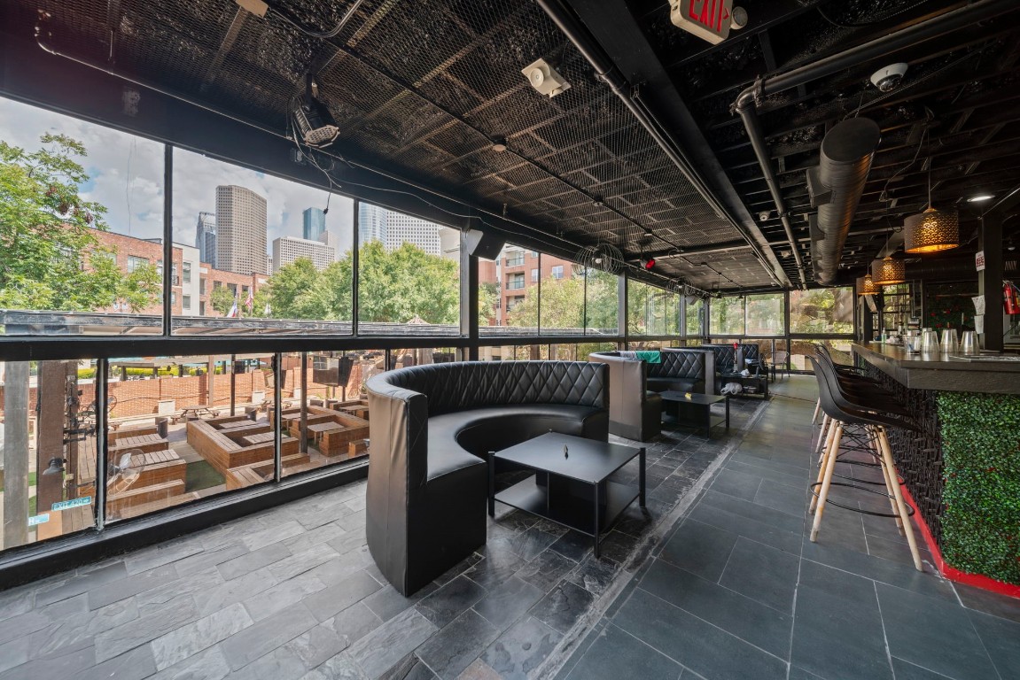 1916 Baldwin Street Houston, TX 77019 - Photo 25 of 37 a view of a chairs and tables in the patio