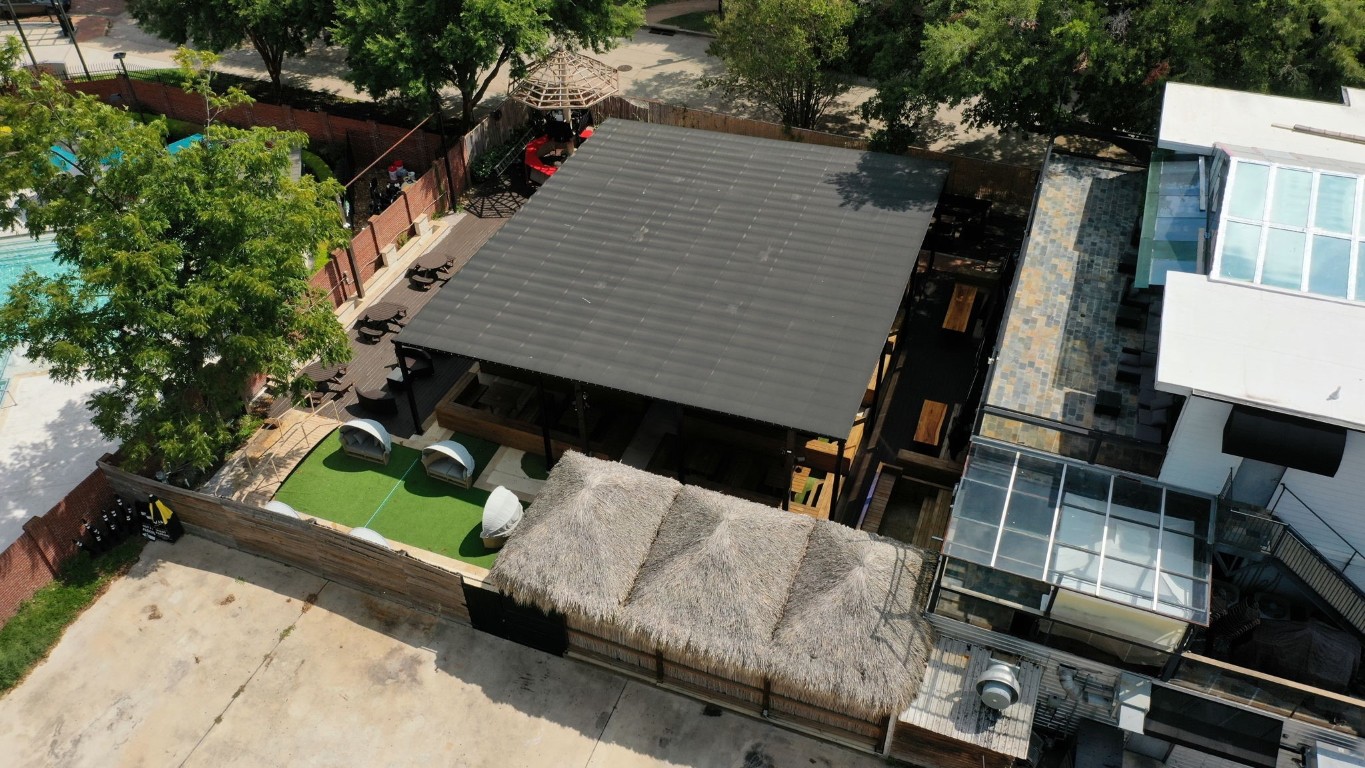 1916 Baldwin Street Houston, TX 77019 - Photo 6 of 37 an aerial view of a house roof deck with couches and chairs