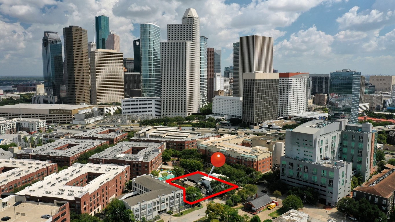 1916 Baldwin Street Houston, TX 77019 - Photo 9 of 37 a city street filled with lots of tall buildings