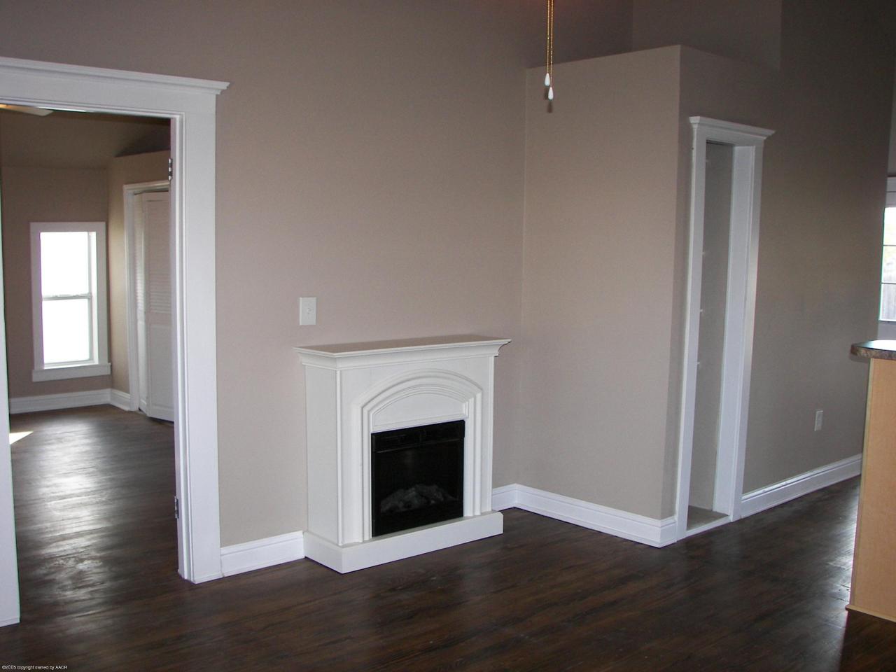 2002 8th Avenue Canyon, TX 79015 - Photo 4 of 6 a view of a livingroom with wooden floor and a fireplace