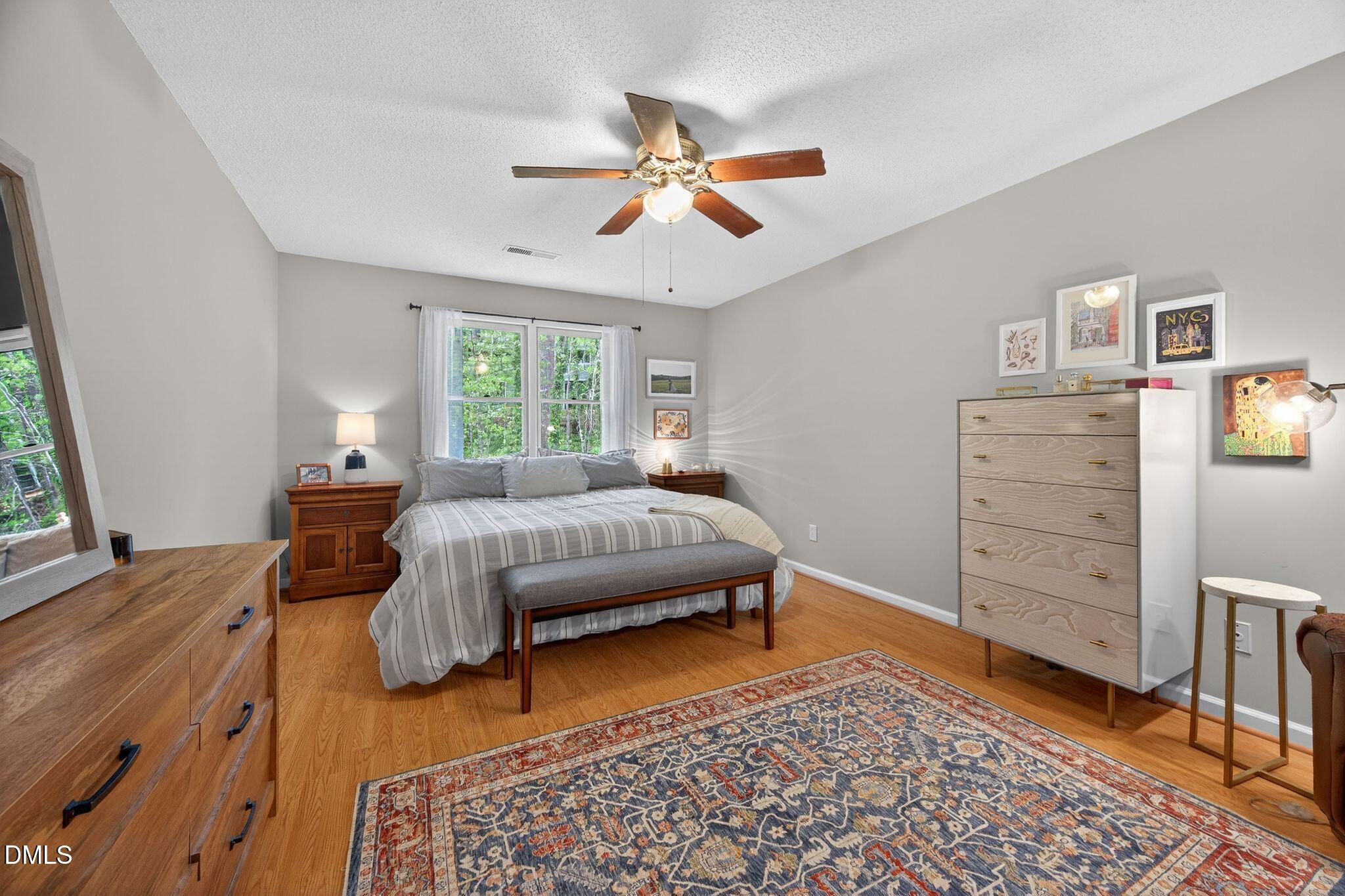 3838 Carnegie Lane Raleigh, NC 27612 - Photo 15 of 40 44_13-3838-carnegie-ln-primary-bedroom
