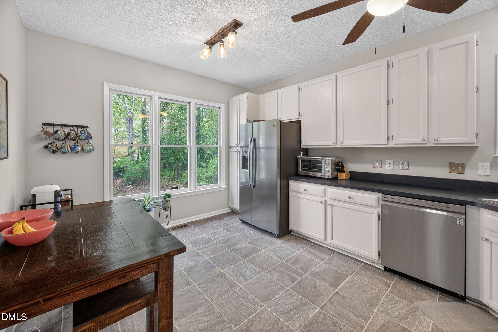 3838 Carnegie Lane Raleigh, NC 27612 - Photo 10 of 40 37_06-3838-carnegie-ln-kitchen